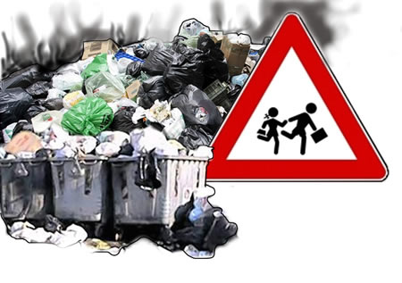 immagine simbolica: la scuola minacciata dai rifiuti